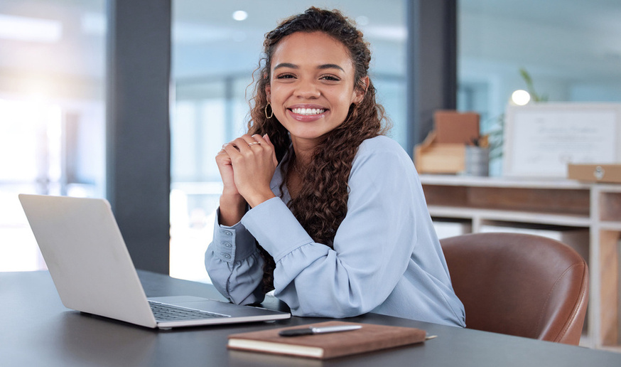 Smiling student starting their studies in a cafe